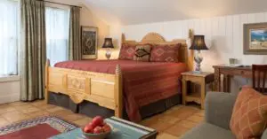 the bed and furnishings inside of the Chimayo Room
