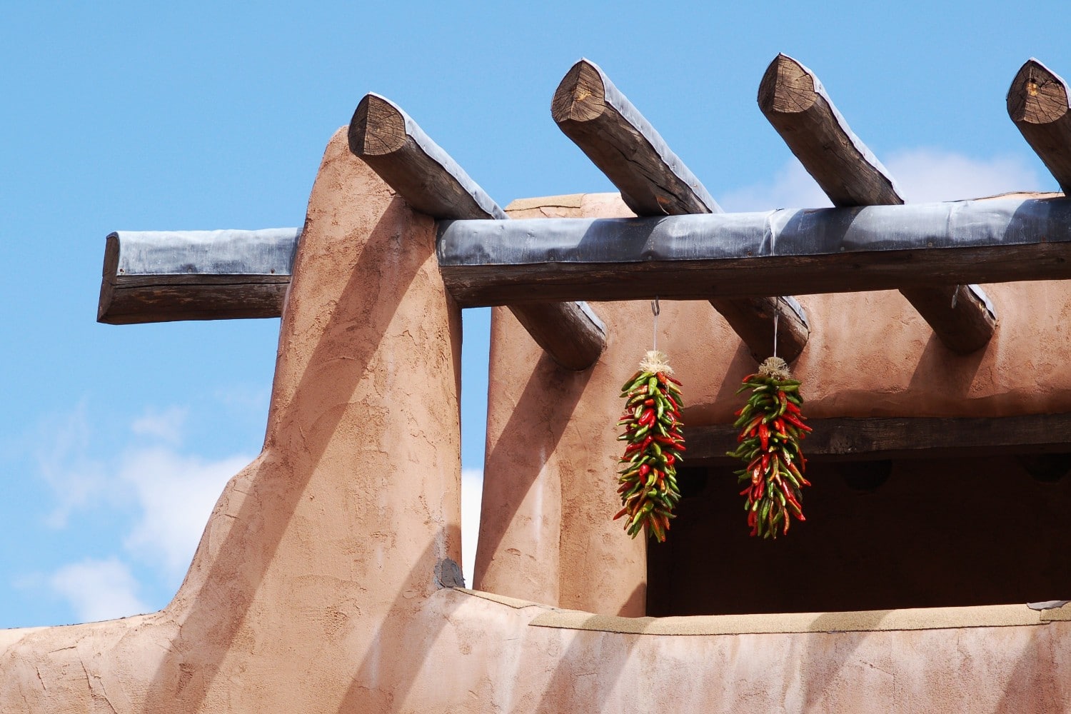 adobe building with hanging chiles