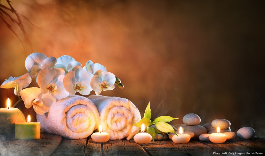 Two Towels, Bamboo, candles and pebble of Stones For Natural Massage