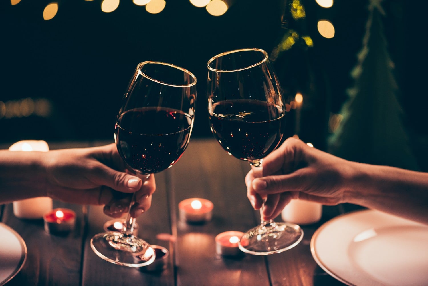 couple clinking wine glasses at Romantic Restaurants in Santa Fe