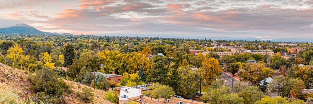 Gorgeous panoramic view of Santa Fe in fall, from one of the best Santa Fe hiking trails